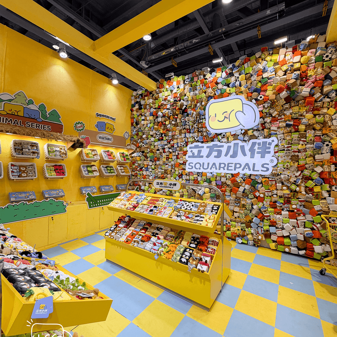 SquarePals product launch event display featuring colorful products and vibrant wall décor.