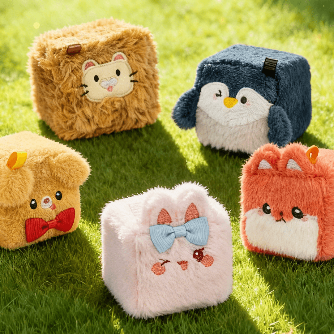 SquarePals Mini Animal Beans in various cute designs on a sunny grassy background.