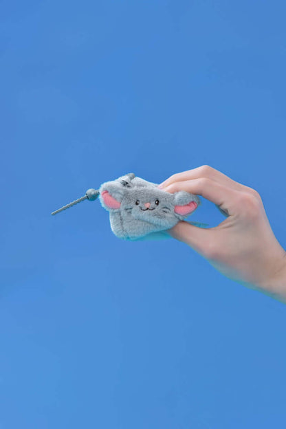 Mini squishy mouse plush toy being held against a blue background, perfect for on-the-go fun.
